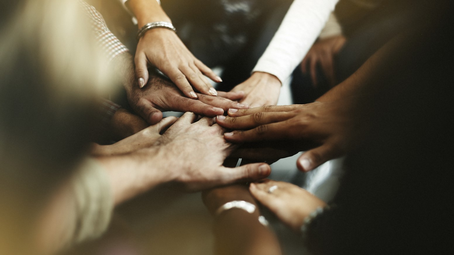 Mindset Therapy Toronto closeup diverse people joining their hands